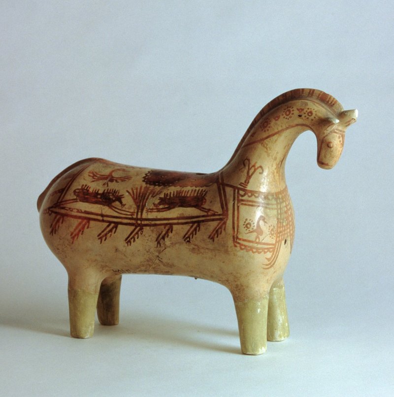 Painted ceramic horse figurine with geometric patterns and animal scenes from the Iranian Plateau